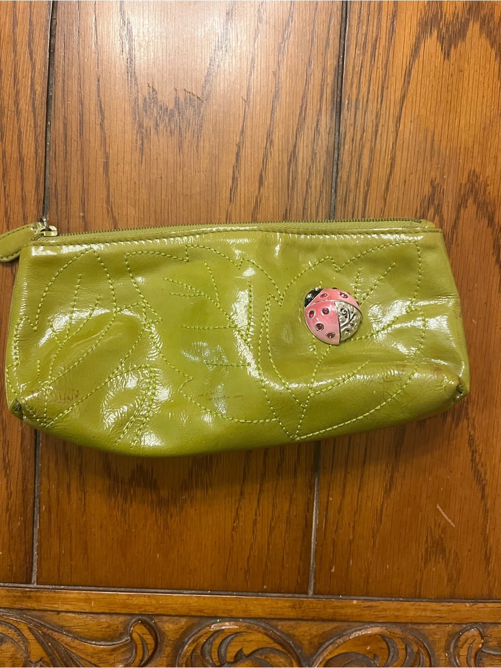 Brighton Olive Green Patent Cosmetic Pouch with Pink Ladybug Charm
